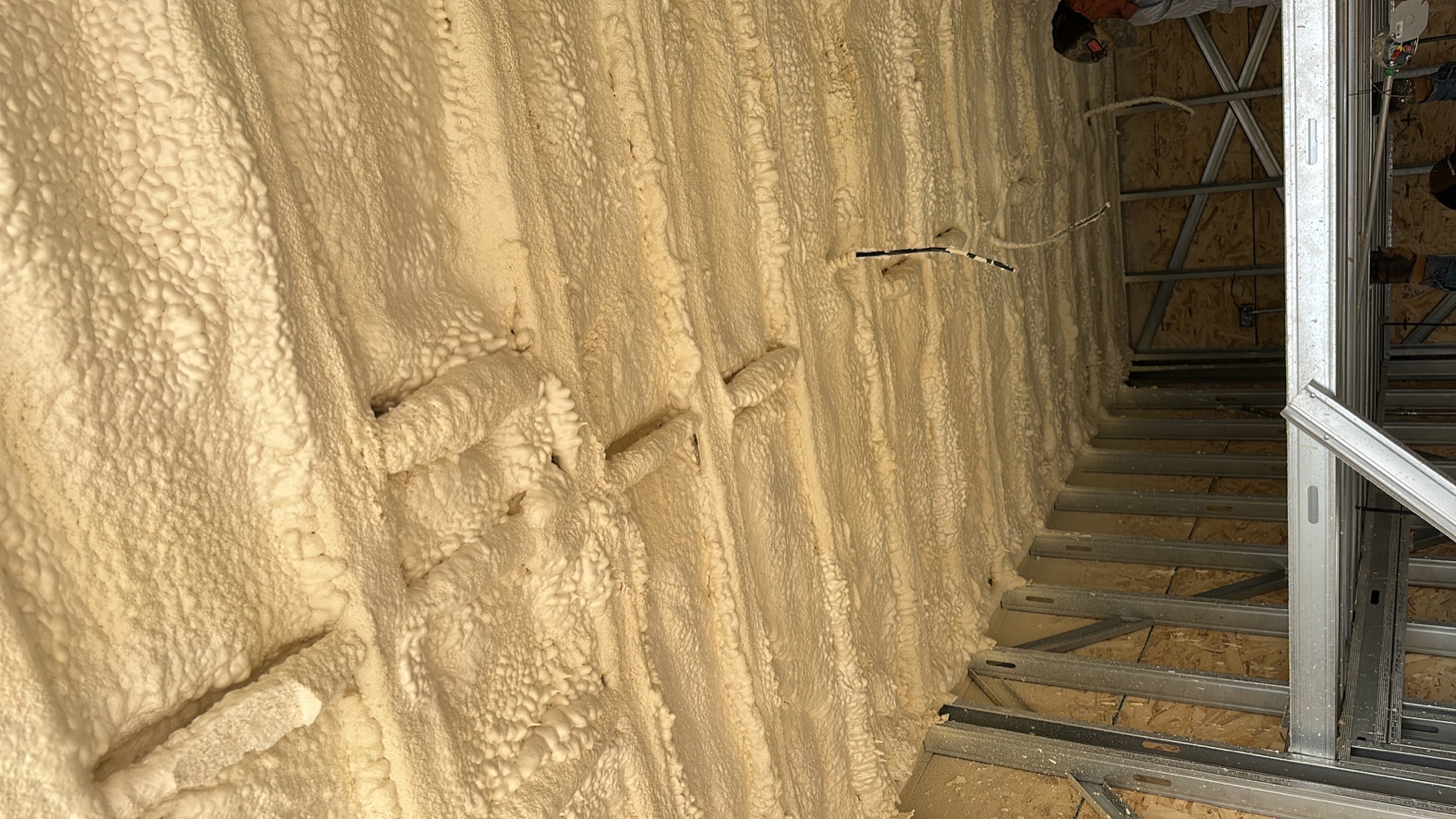 Spray-applied foam insulation inside the Rise20 roof assembly