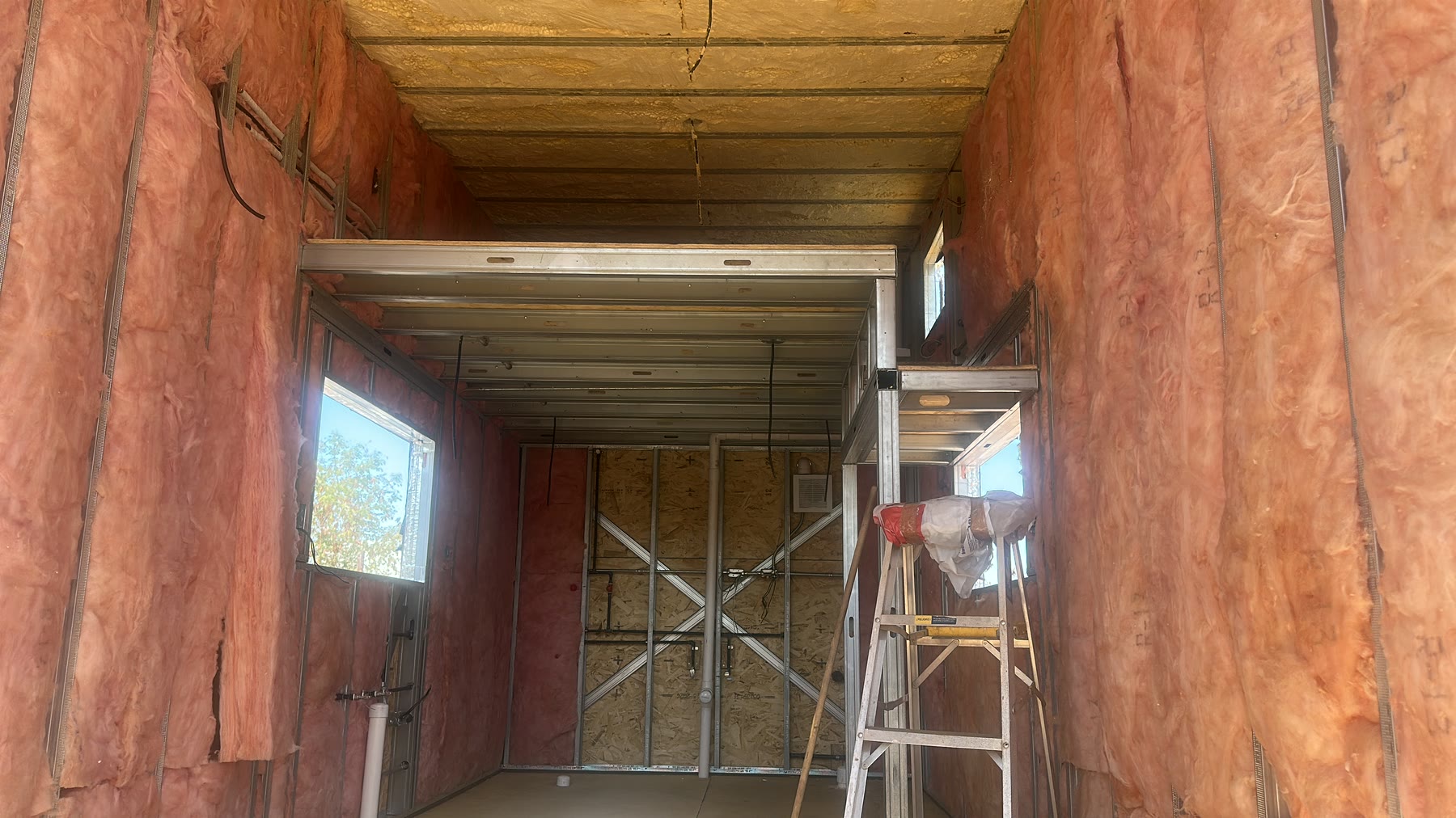 Rise20 wall and ceiling insulation installed inside the steel-framed shell